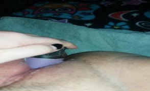 Using a purple dildo to masturbate
