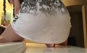 Shaking her ass on a big dildo